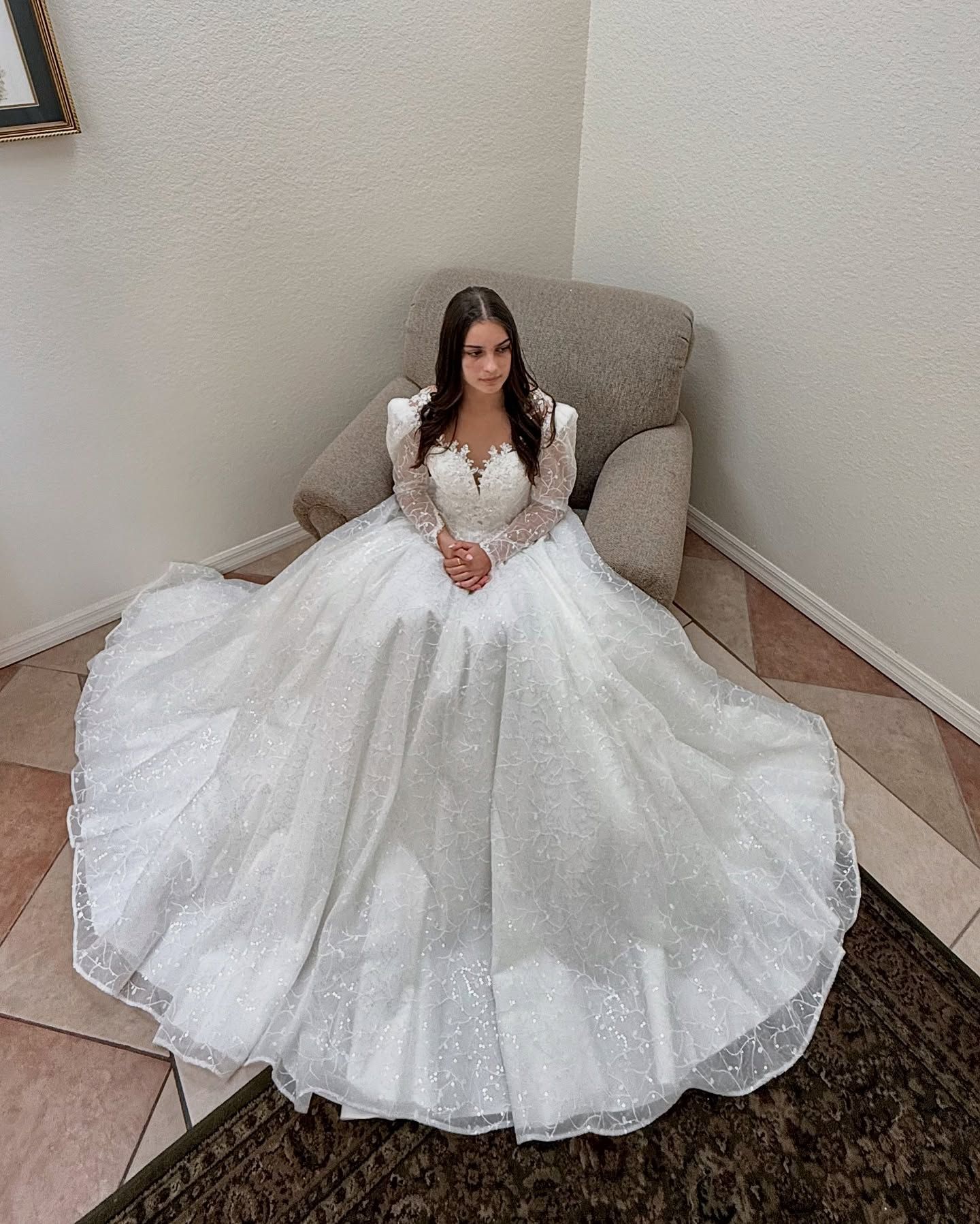 Bride seated in altered ball gown
