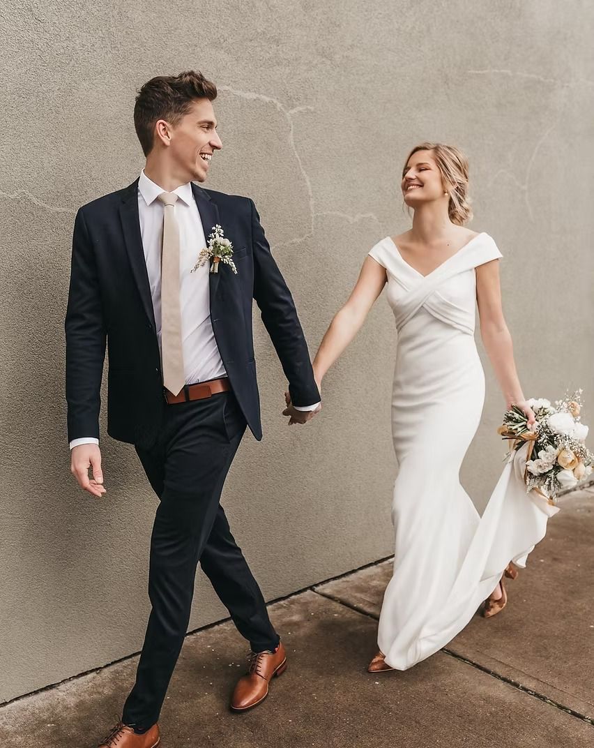 Couple in tailored wedding attire